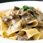 Rich & Creamy Beef Stroganoff Served Over Perfect Egg Noodles